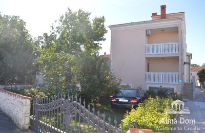 We are selling a house with five apartments in Medulin.