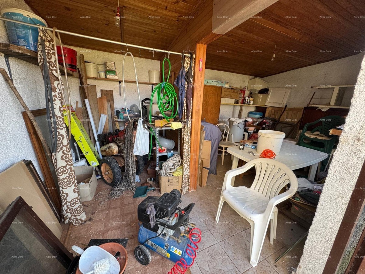 Kuća u centru Marčane s 2 stana, konobom i radionom 22