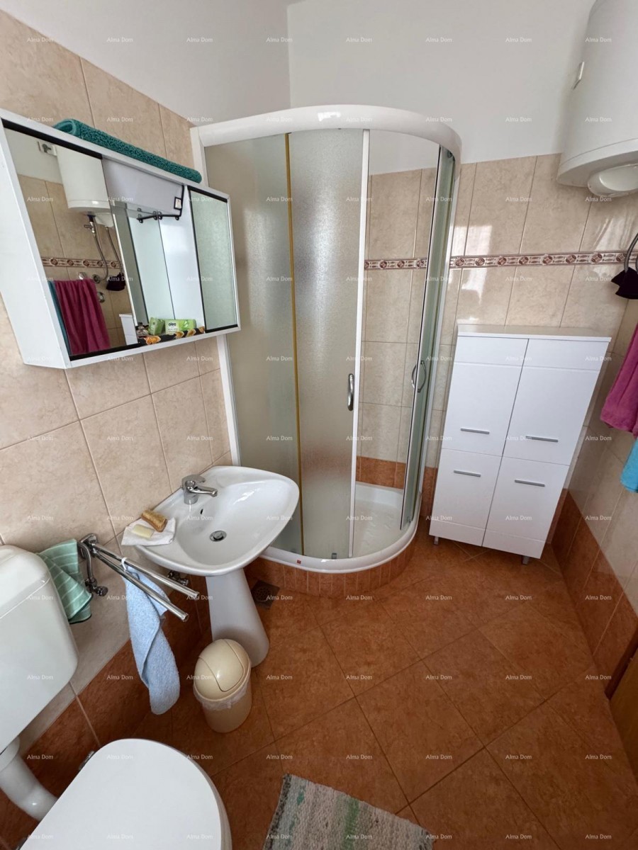 Kuća u centru Marčane s 2 stana, konobom i radionom 18