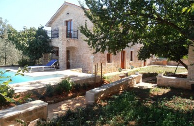 Marčana. Two stone houses with a swimming pool.