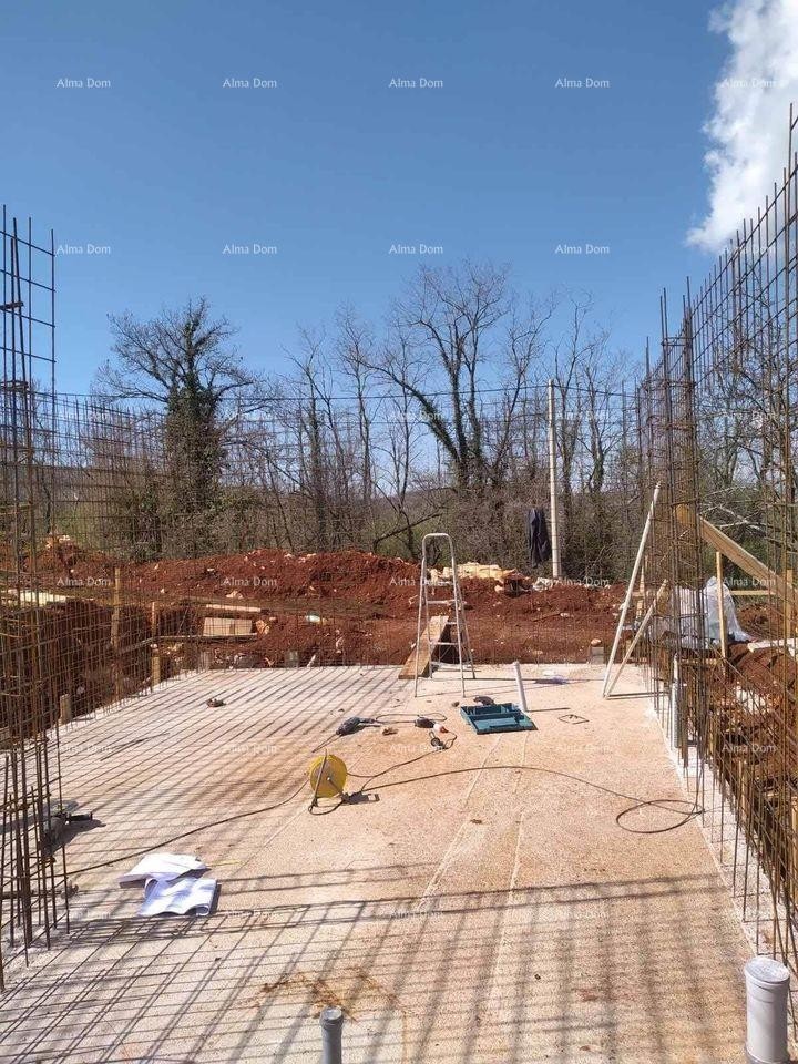 Sale of building land with construction started, view of Motovun 4