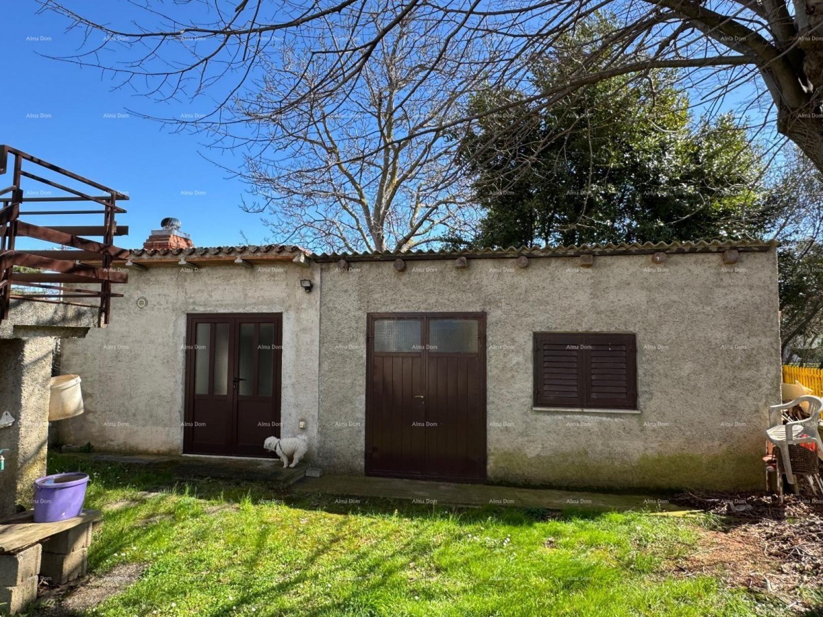 Kuća u centru Marčane s 2 stana, konobom i radionom 20