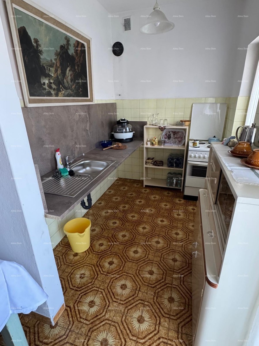 Kuća u centru Marčane s 2 stana, konobom i radionom 7