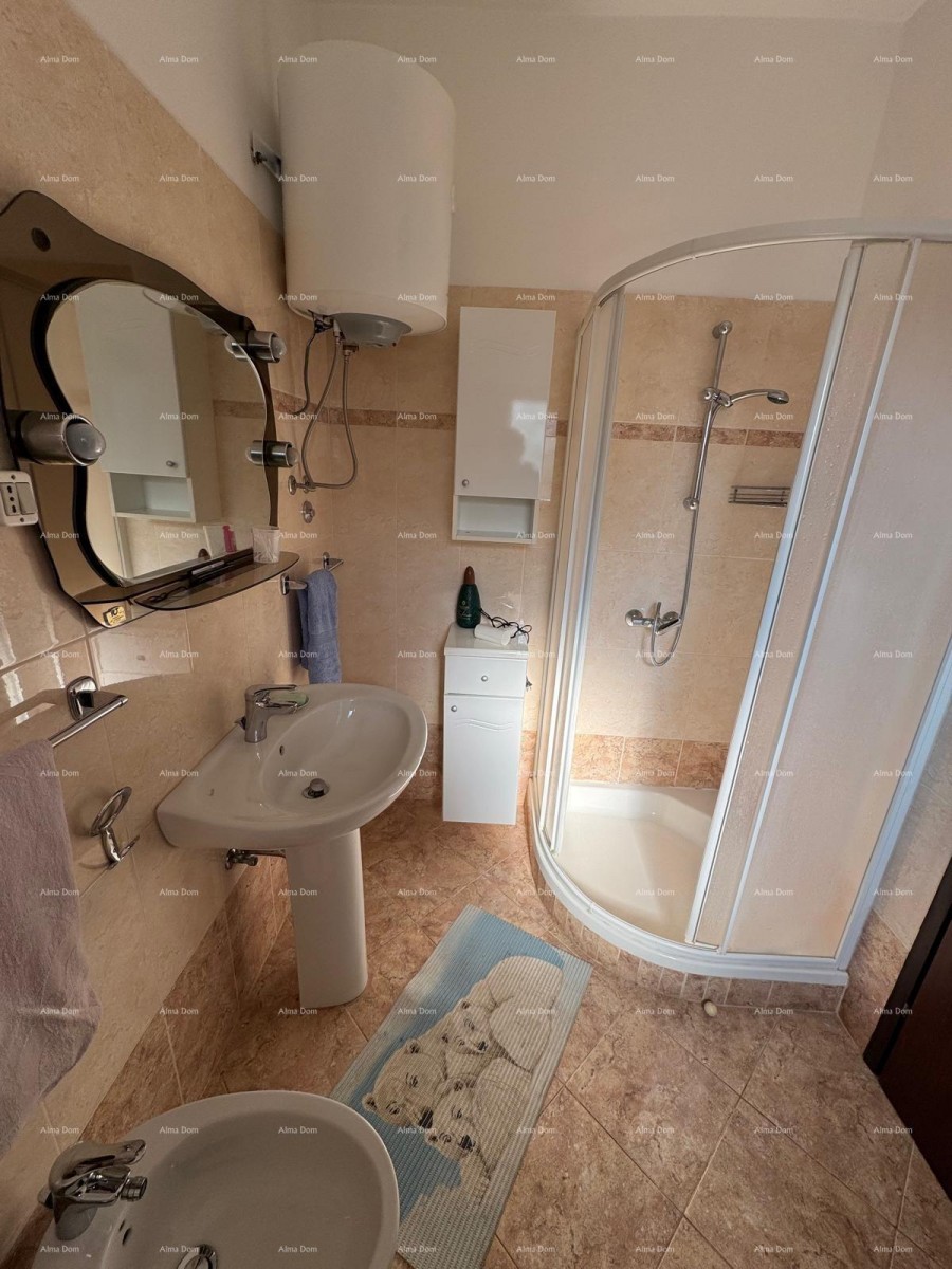 Kuća u centru Marčane s 2 stana, konobom i radionom 4