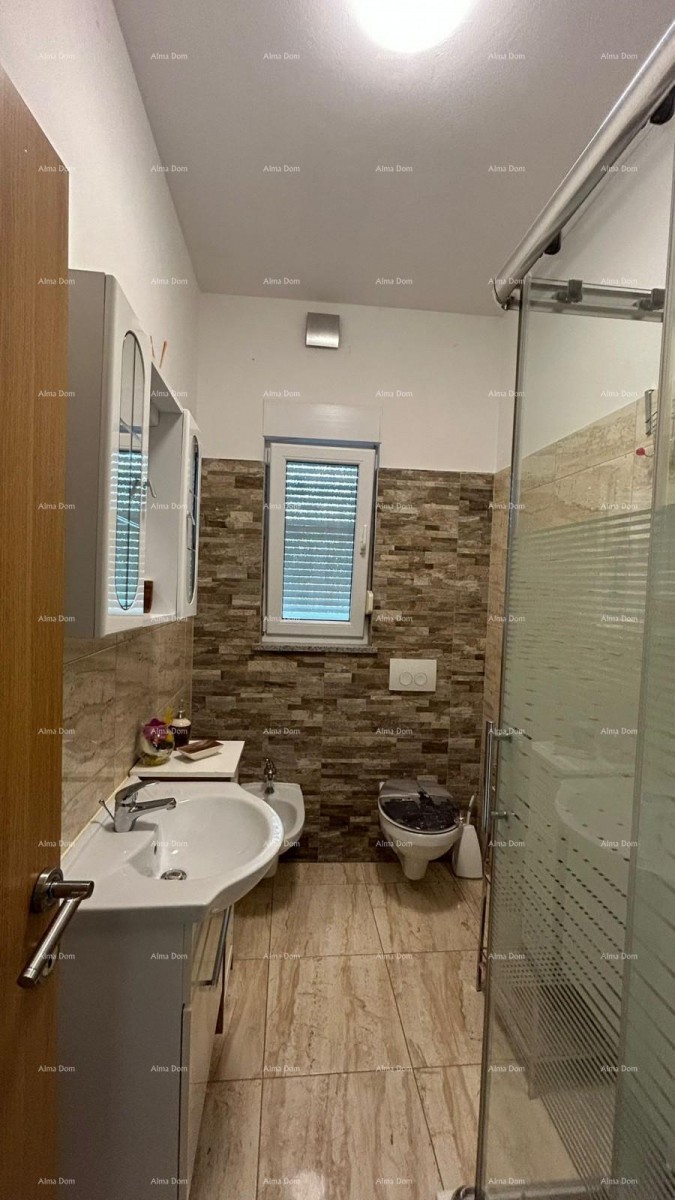 Pula Veli vrh. We are selling a house with multiple apartments and a swimming pool. 13