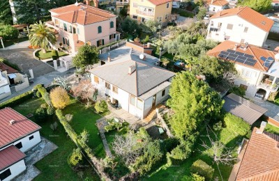House with two residential units and great development potential – first row to the sea, Umag