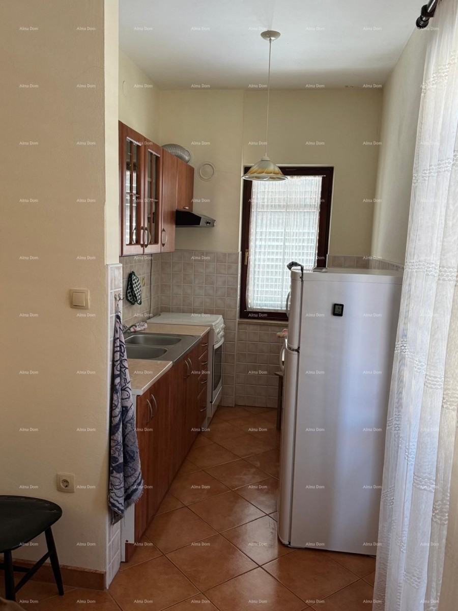 Kuća u centru Marčane s 2 stana, konobom i radionom 13