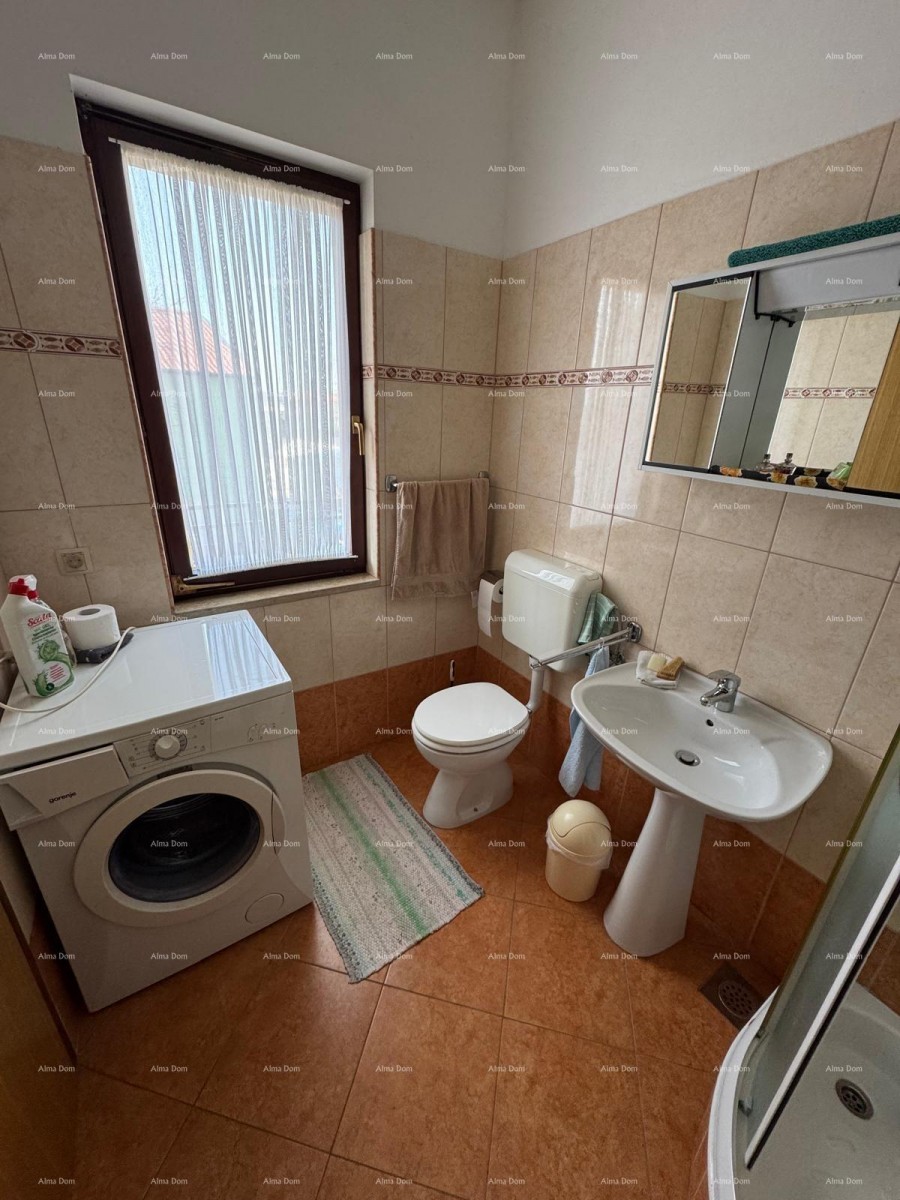 Kuća u centru Marčane s 2 stana, konobom i radionom 17